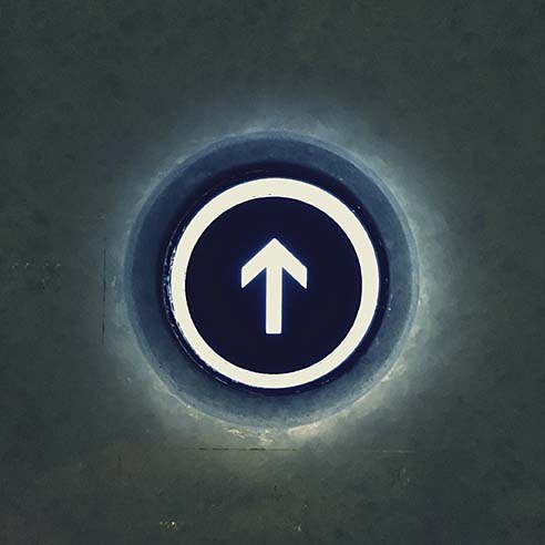 Close-Up Of Going Up Button Of Elevator