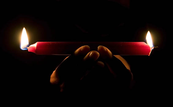 Burning candle both ends