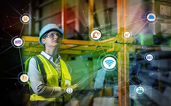 IoT concept and woman working in an industrial factory