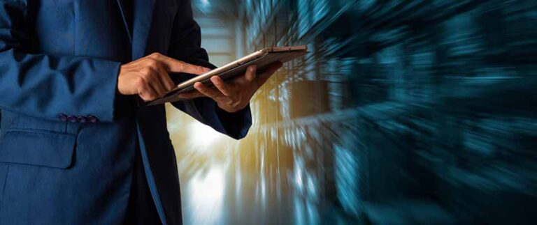 Man using tablet - What are the Advantages of Proposal Automation Software?